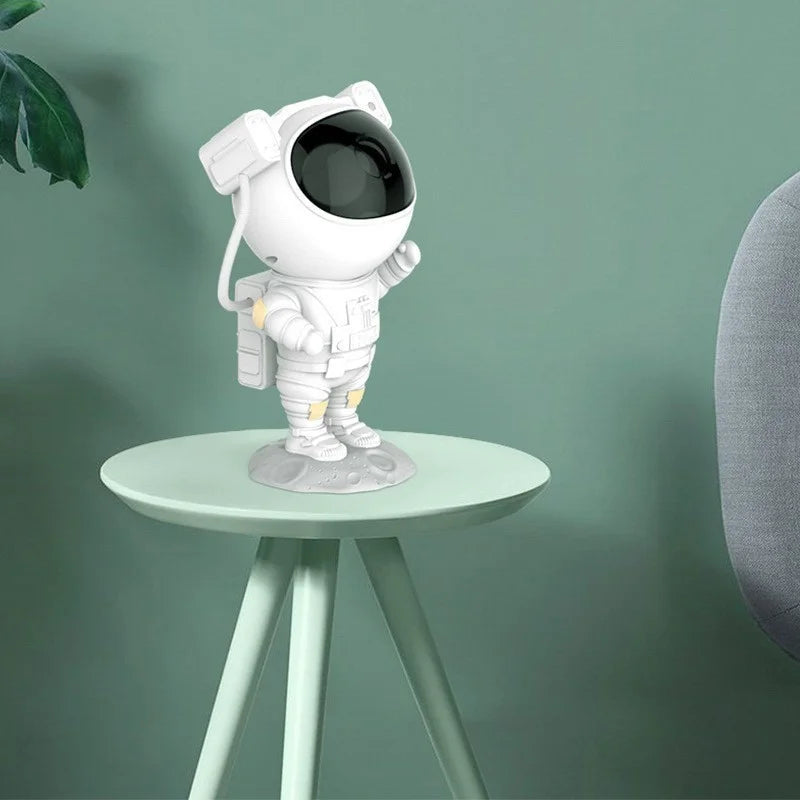 🌌 Luminária Projetora Astronauta™ – Traga o Universo para Dentro de Casa!
